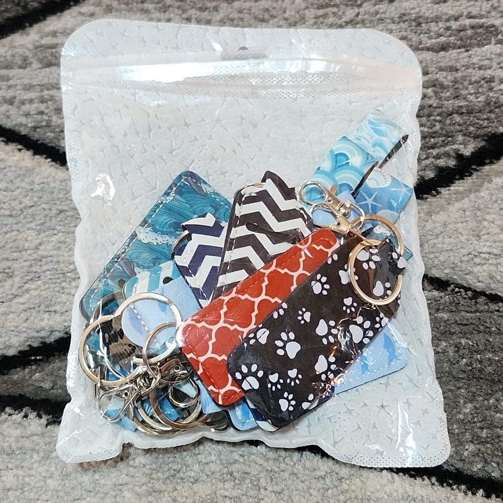 ASSORTED 15 PIECE NEOPRENE WRISTLETS & STANDARD CHAP STICK HOLDERS KEYCHAINS